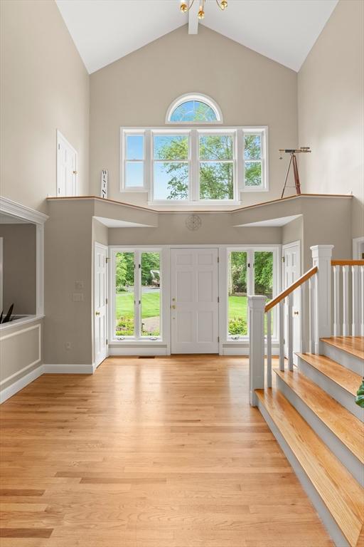 9 Twig Rush Ln, West Newbury, MA 01985 - foyer featuring high vaulted ceiling and light wood-type flooring