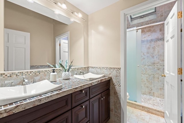 9 Twig Rush Ln, West Newbury, MA 01985 - full bathroom featuring double vanity, a stall shower, and tile walls