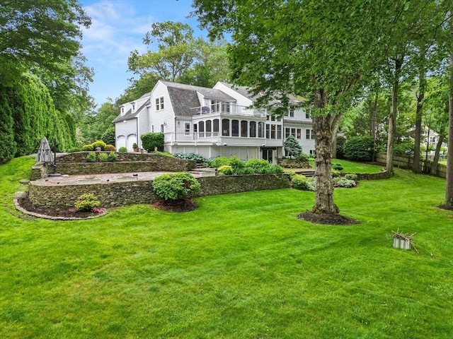 9 Twig Rush Ln, West Newbury, MA 01985 - rear view of house with a gambrel roof, a deck, and a sunroom