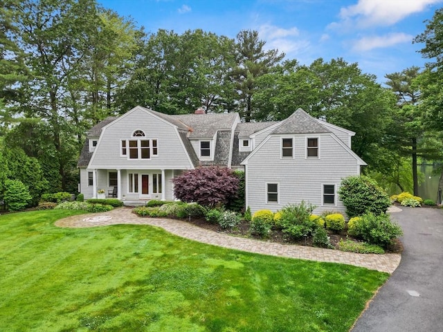 9 Twig Rush Ln, West Newbury, MA 01985 - shingle-style home with a gambrel roof, a front lawn, roof with shingles, and a chimney