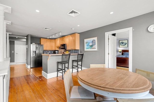 99 Washington St Unit 23, Salem, MA 01970 - dining space featuring ornate columns, light wood finished floors, and recessed lighting