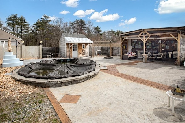 surrounding community with a fenced backyard, an outbuilding, a patio, and a swimming pool