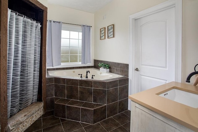 full bath with tile patterned flooring, a garden tub, a sink, and a shower with shower curtain