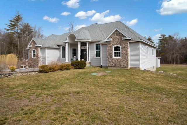 single story home with stone siding and a front yard