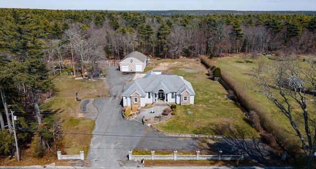 aerial overview of property's location featuring a heavily wooded area