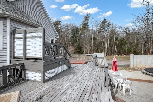 wooden terrace with a patio