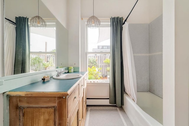 8 Oak St Unit 8, Cambridge, MA 02139 - bathroom featuring a baseboard heating unit, healthy amount of natural light, vanity, and shower / tub combo