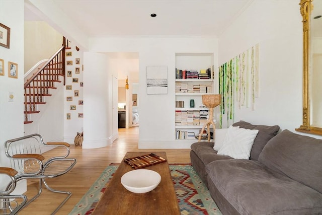 8 Oak St Unit 8, Cambridge, MA 02139 - living area with wood finished floors, ornamental molding, and stairs