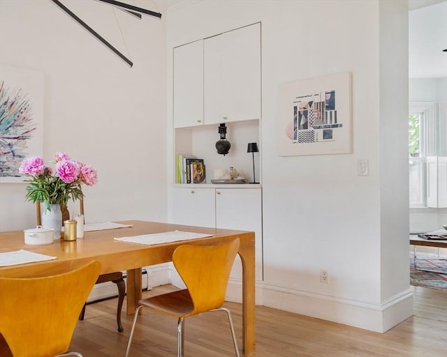 8 Oak St Unit 8, Cambridge, MA 02139 - dining area with light wood-style flooring and baseboards