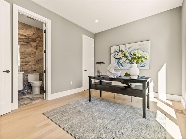 office area with hardwood / wood-style floors