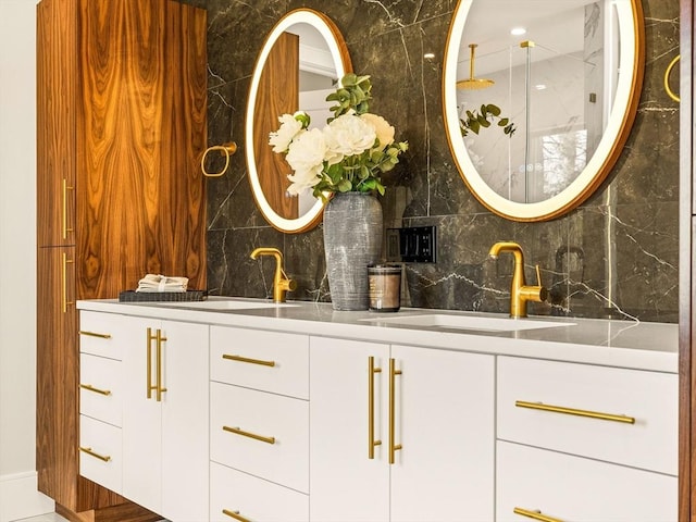 bar with sink, white cabinets, and tasteful backsplash