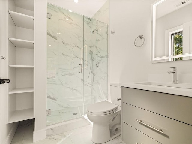 bathroom with toilet, an enclosed shower, and vanity