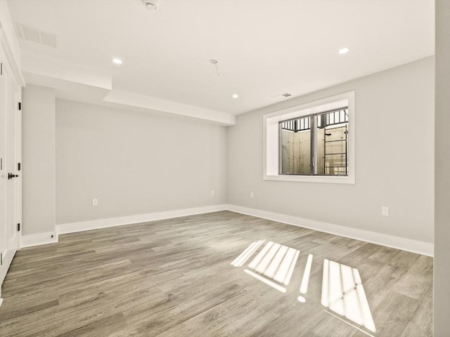 unfurnished room featuring wood-type flooring