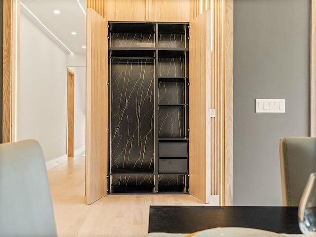 bathroom with wood-type flooring