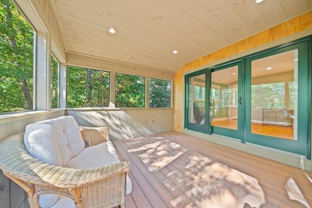 sunroom / solarium featuring wood ceiling