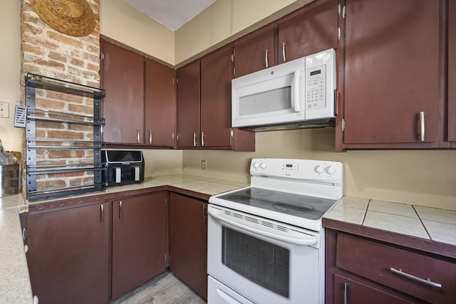 42 Briggs Ave, Pittsfield, MA 01201 - kitchen featuring white appliances and tile countertops