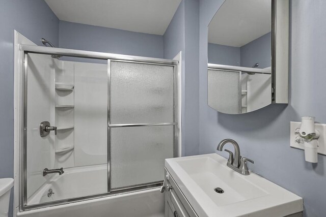 42 Briggs Ave, Pittsfield, MA 01201 - bathroom with toilet, vanity, and bath / shower combo with glass door