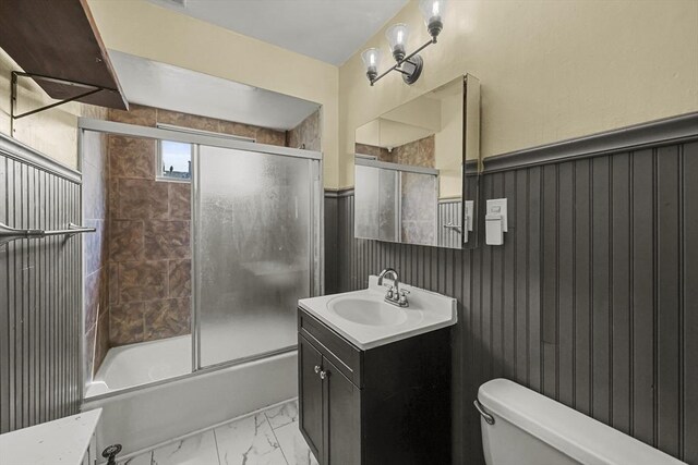 42 Briggs Ave, Pittsfield, MA 01201 - bathroom with vanity, toilet, bath / shower combo with glass door, and marble look tile flooring