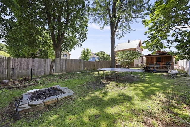 42 Briggs Ave, Pittsfield, MA 01201 - view of yard with an outdoor fire pit and a trampoline