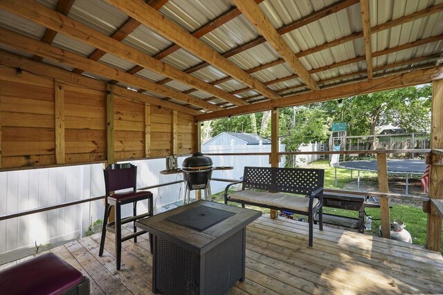 42 Briggs Ave, Pittsfield, MA 01201 - wooden terrace featuring a playground and a trampoline
