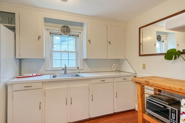 7 Broad St, Belmont, MA 02478 - kitchen featuring light countertops and white cabinetry