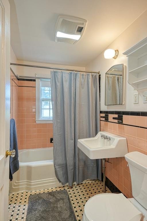 7 Broad St, Belmont, MA 02478 - bathroom with tile walls, shower / bath combo, and wainscoting