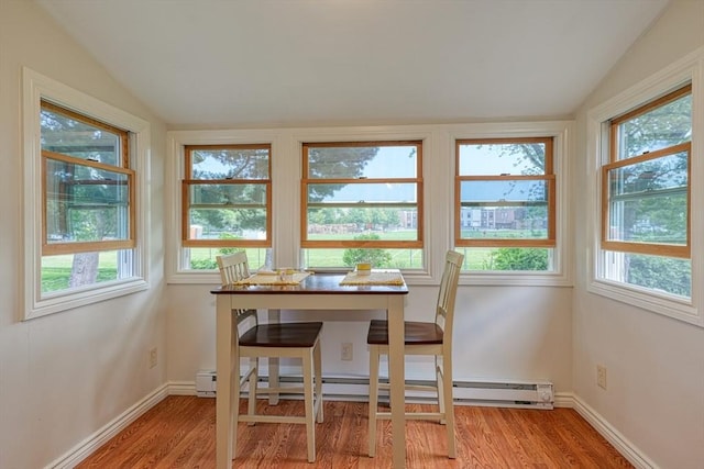 7 Broad St, Belmont, MA 02478 - dining area with lofted ceiling, light wood-type flooring, and a baseboard radiator