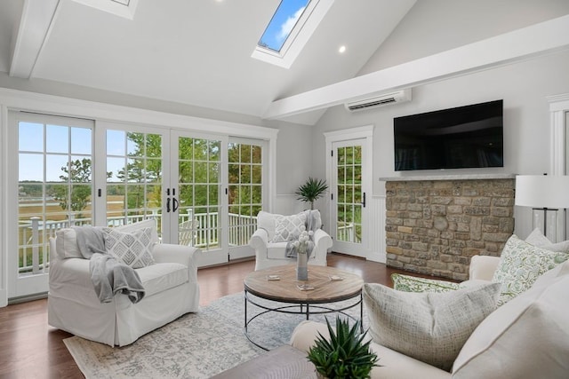 sunroom with french doors, an AC wall unit, and lofted ceiling with beams