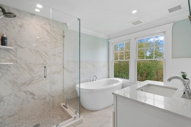 bathroom featuring ornamental molding, shower with separate bathtub, and vanity