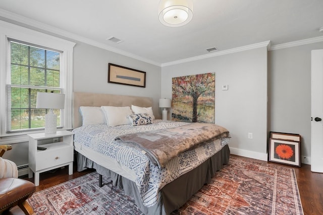 bedroom featuring crown molding, hardwood / wood-style flooring, and multiple windows