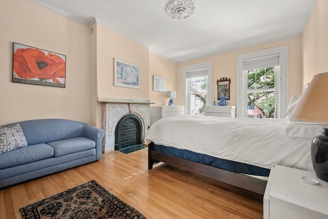 66 Rutland St, Boston, MA 02118 - bedroom featuring wood finished floors and a fireplace with flush hearth