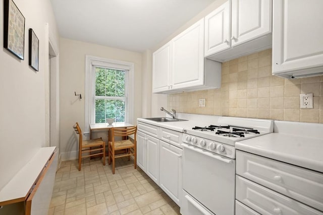 66 Rutland St, Boston, MA 02118 - kitchen featuring white gas range, backsplash, light countertops, and white cabinetry