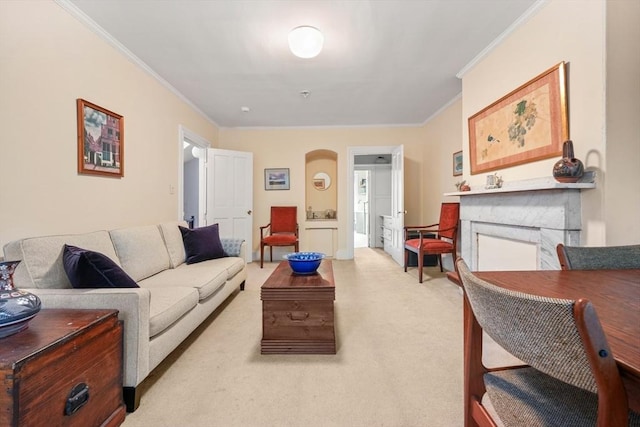 66 Rutland St, Boston, MA 02118 - living room with ornamental molding, light carpet, a fireplace, and arched walkways