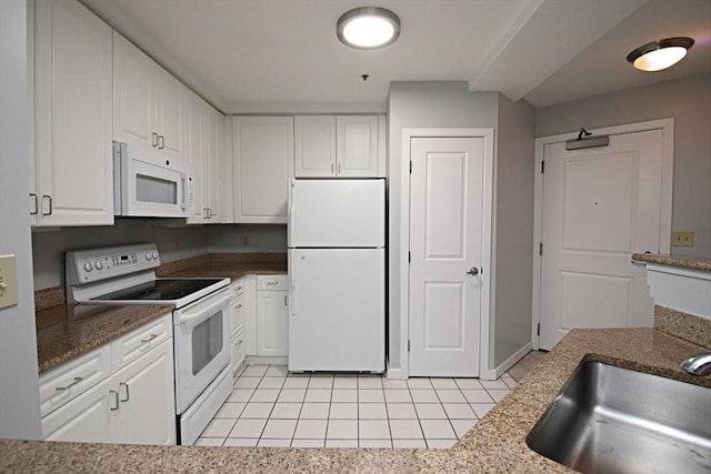 kitchen featuring a sink, white appliances, and white cabinets