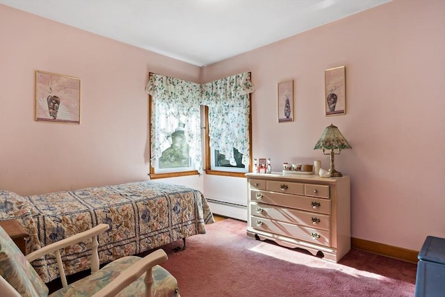 carpeted bedroom with a baseboard heating unit