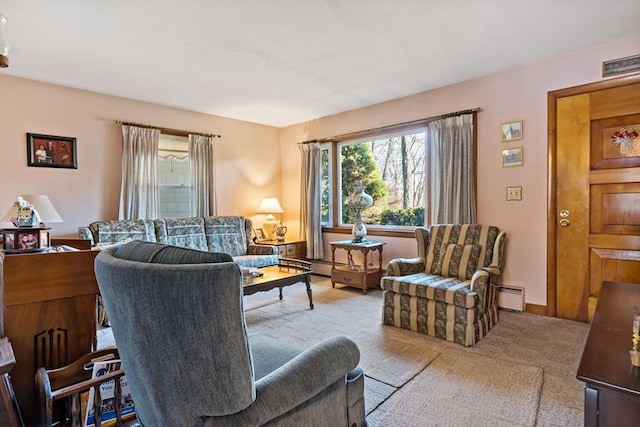 living room featuring a baseboard radiator and light carpet