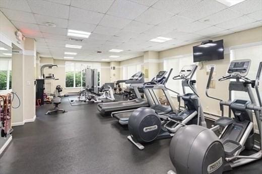 workout area with a paneled ceiling