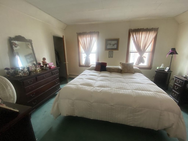 carpeted bedroom with a baseboard heating unit