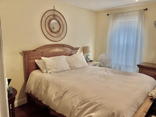 bedroom featuring baseboards