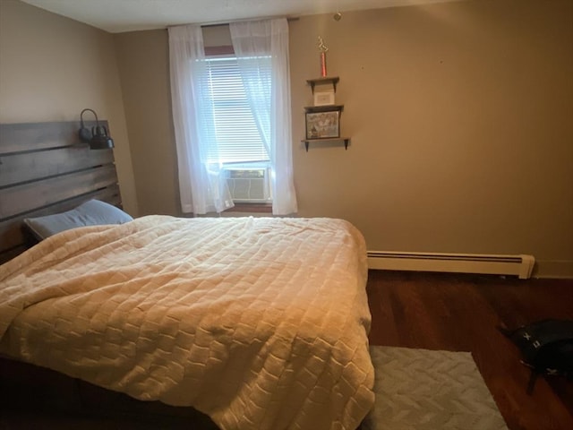 bedroom featuring a baseboard radiator, cooling unit, and wood finished floors