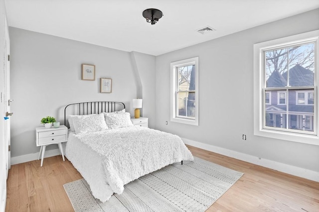 bedroom with light wood-type flooring