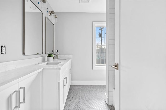 bathroom with tile patterned floors and vanity