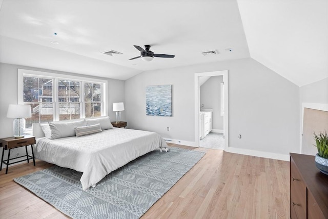 bedroom with ceiling fan, vaulted ceiling, and light hardwood / wood-style flooring