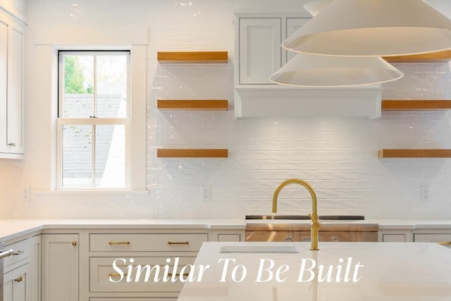 kitchen featuring light countertops, open shelves, and tasteful backsplash