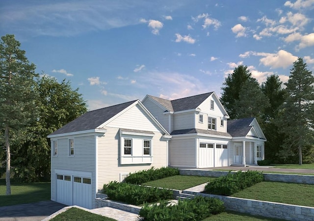 view of front of house with a garage, a front lawn, and aphalt driveway
