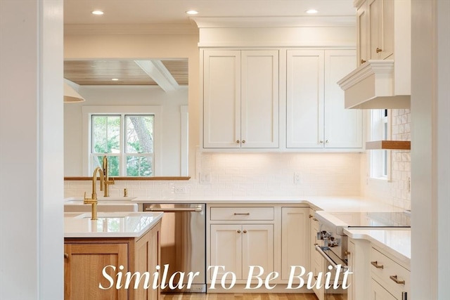 kitchen with crown molding, decorative backsplash, light countertops, a sink, and stainless steel appliances