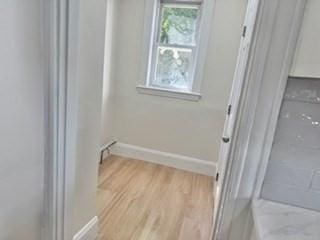 16 Fowler St, Boston, MA 02121 - washroom with light wood-style floors and baseboards