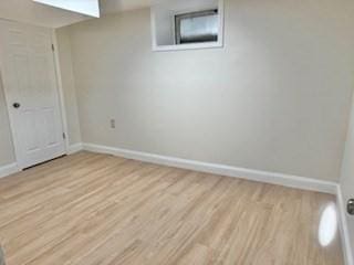 16 Fowler St, Boston, MA 02121 - below grade area featuring baseboards and wood finished floors