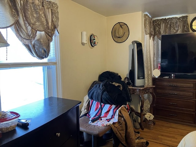 bedroom with hardwood / wood-style flooring