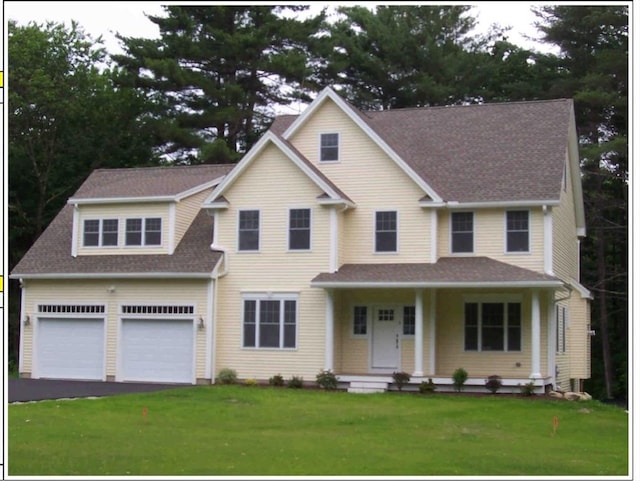 6 Beacon Ct, Acton, MA 01720 - view of front of property with covered porch, a front lawn, asphalt driveway, and a shingled roof